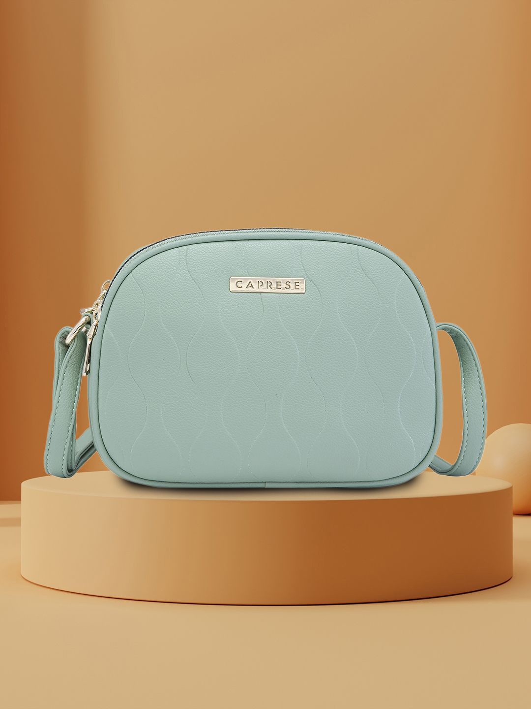 

Caprese Women Solid Structured Sling Bag, Sea green