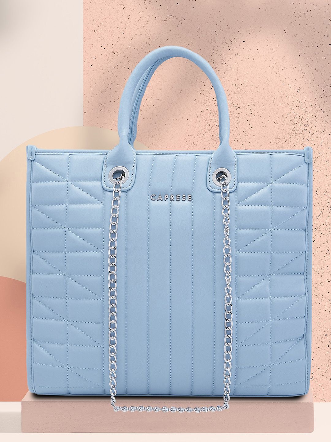 

Caprese Women Solid Structured Handheld Bag, Blue