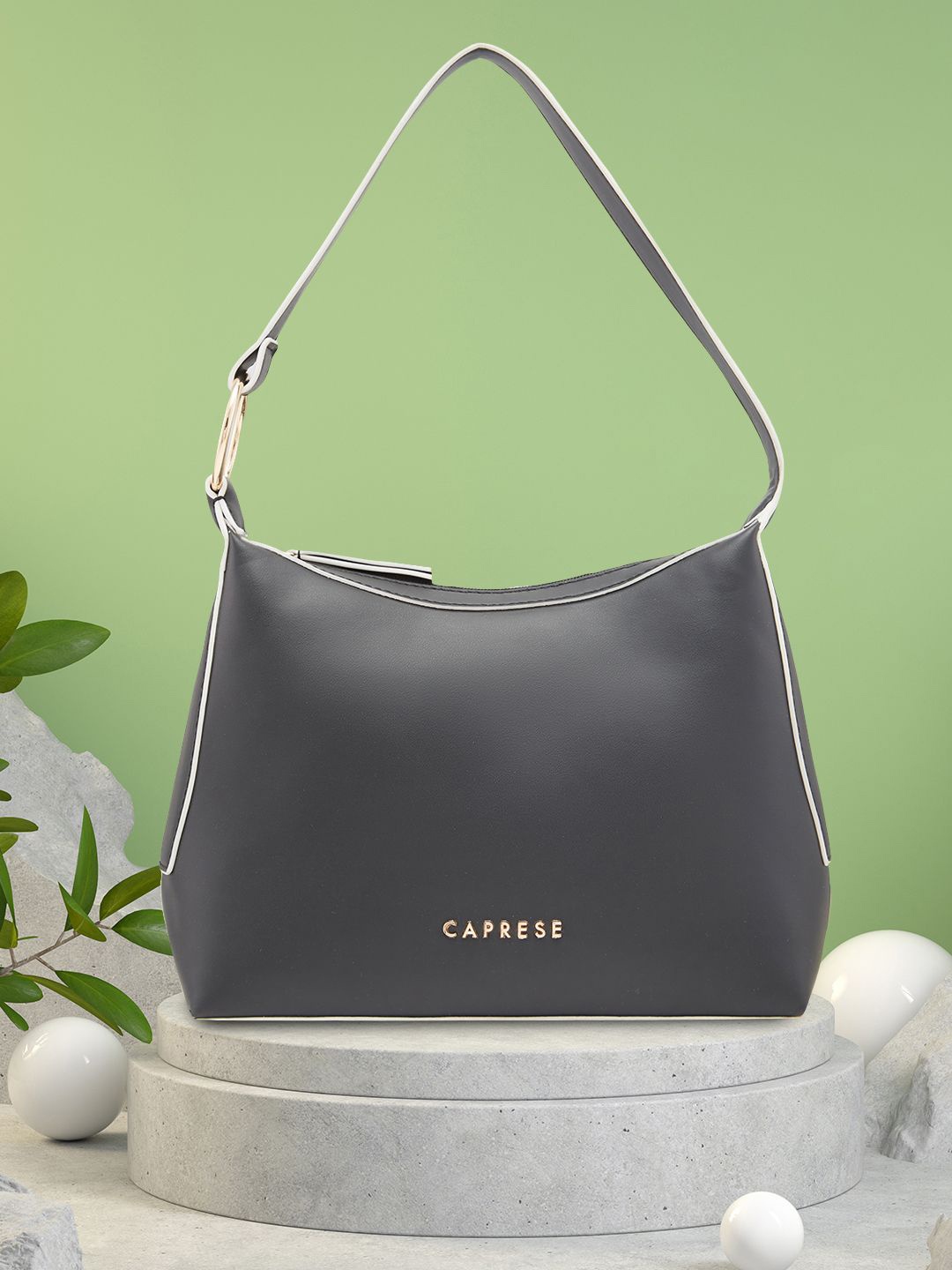 

Caprese Women Solid Structured Handheld Bag, Black