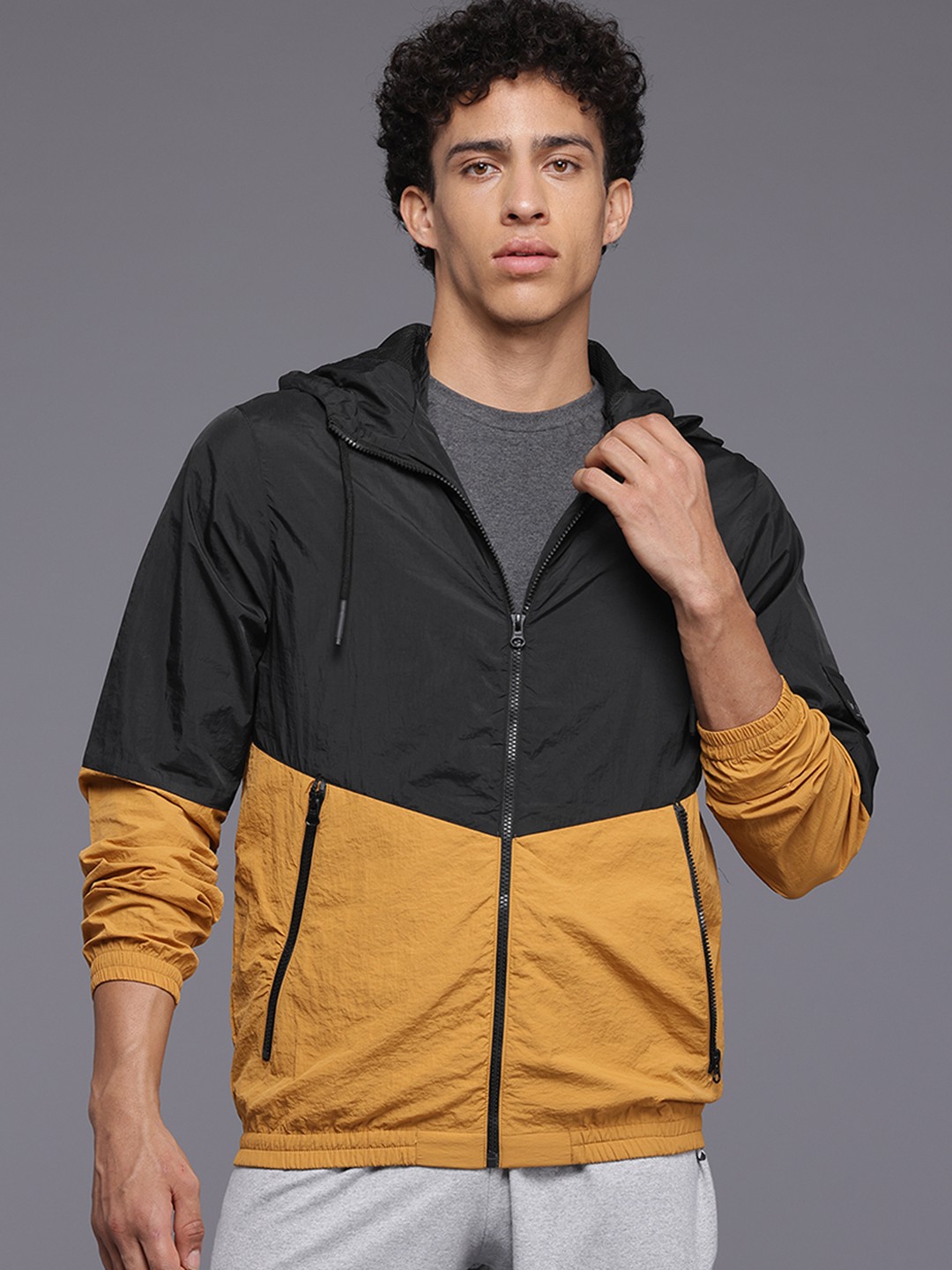 

HRX by Hrithik Roshan Men Colourblocked Windcheater Sporty Jacket, Mustard