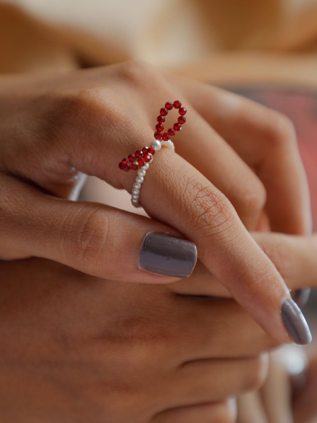 

House of Aadyaa Silver Pearls Bow-Ring With Ruby Stone