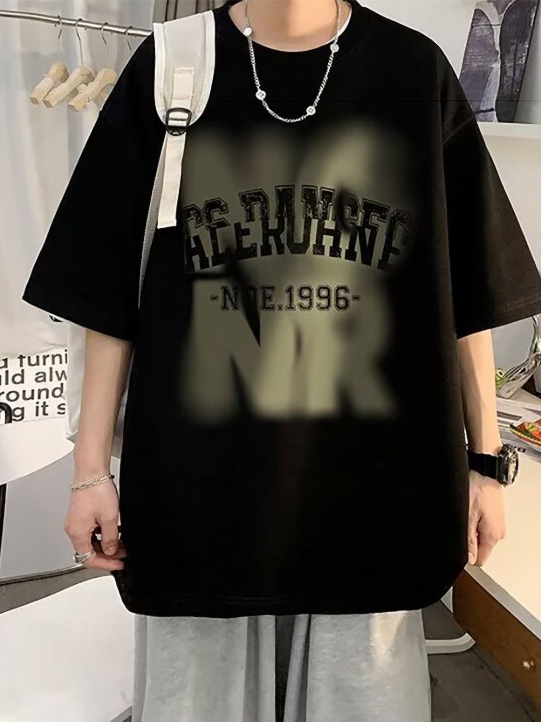 

StyleCast x Revolte Men Typography Printed Round Neck Oversized T-shirt, Black