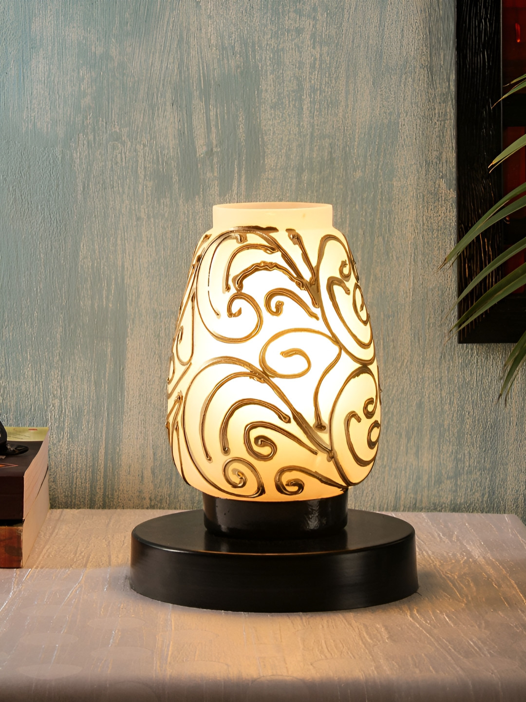 

Devansh White & Gold-Toned Textured Abstract Shaped Glass Table Lamp With Wooden Base