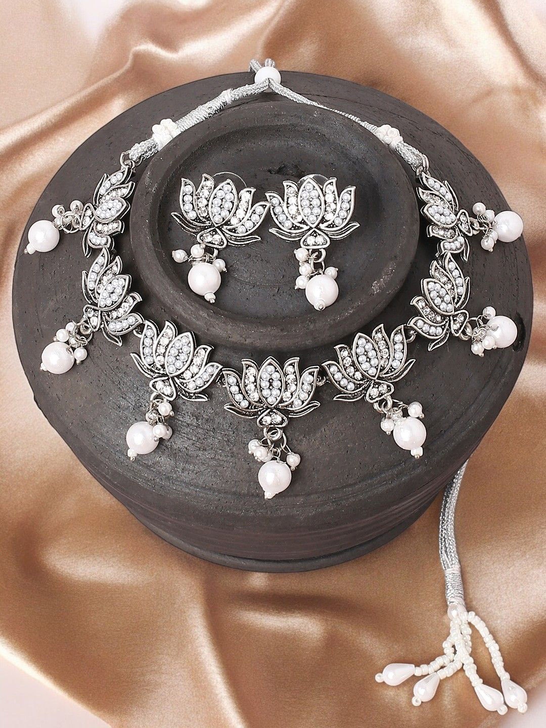 

OOMPH Artificial Stones Pearls Studded & Beaded Oxidized Loutus Jewellery Set, Silver