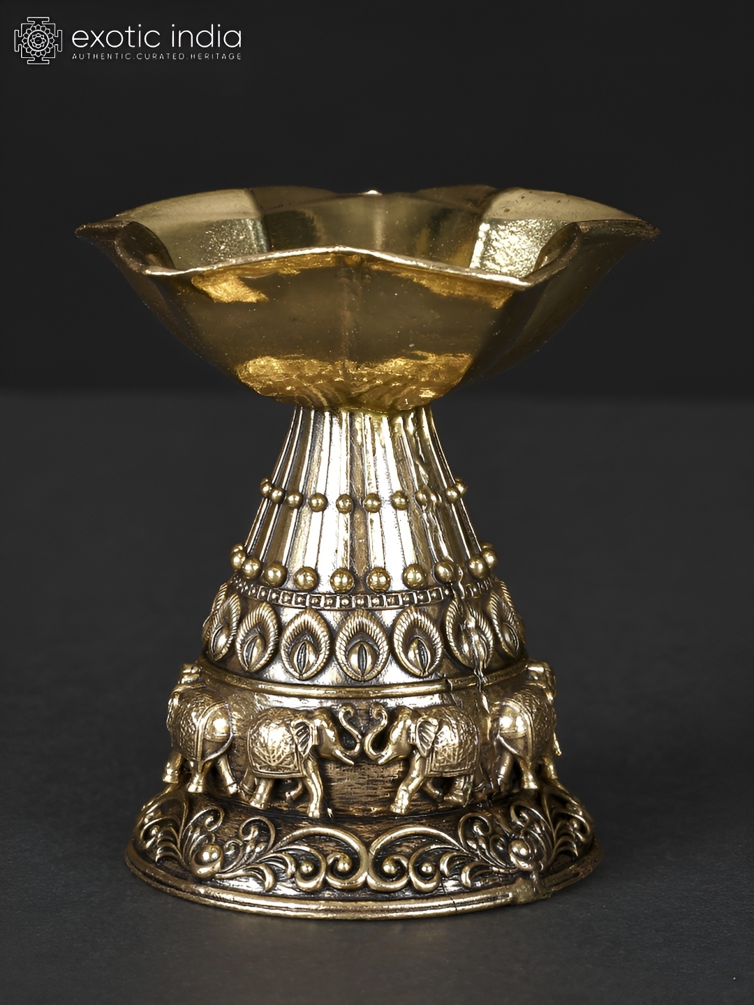 

Exotic India Gold-Toned Brass Diya Religious Figurine Showpiece