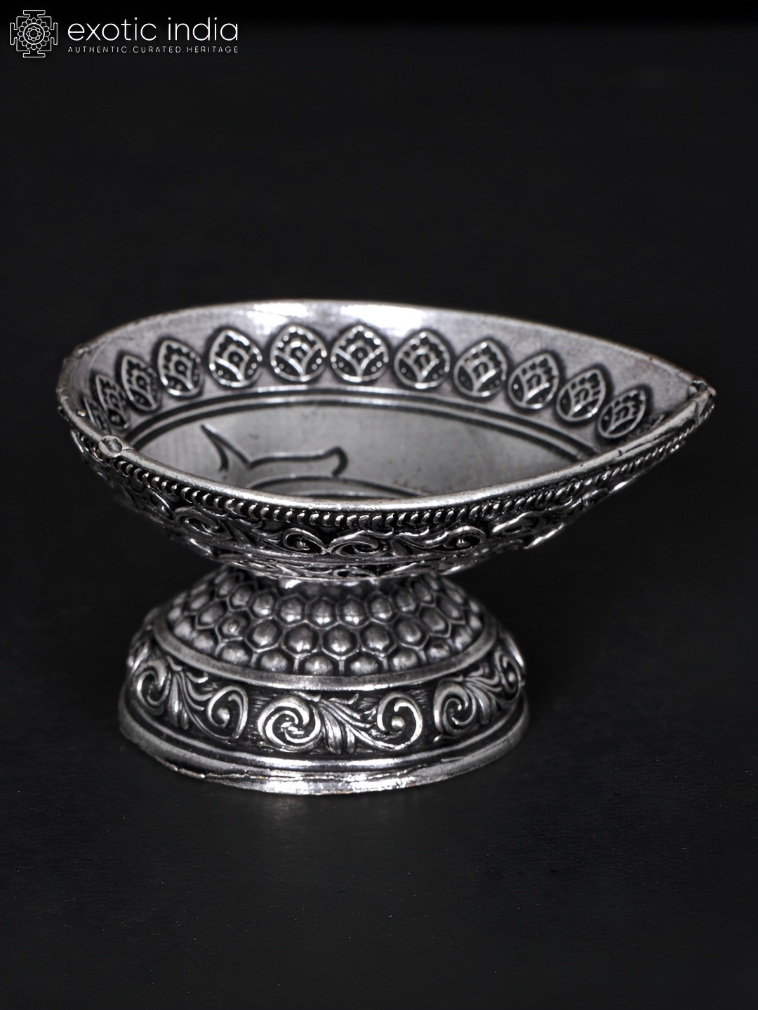 

Exotic India Silver-Toned Diya in Brass Religious Figurine Showpiece