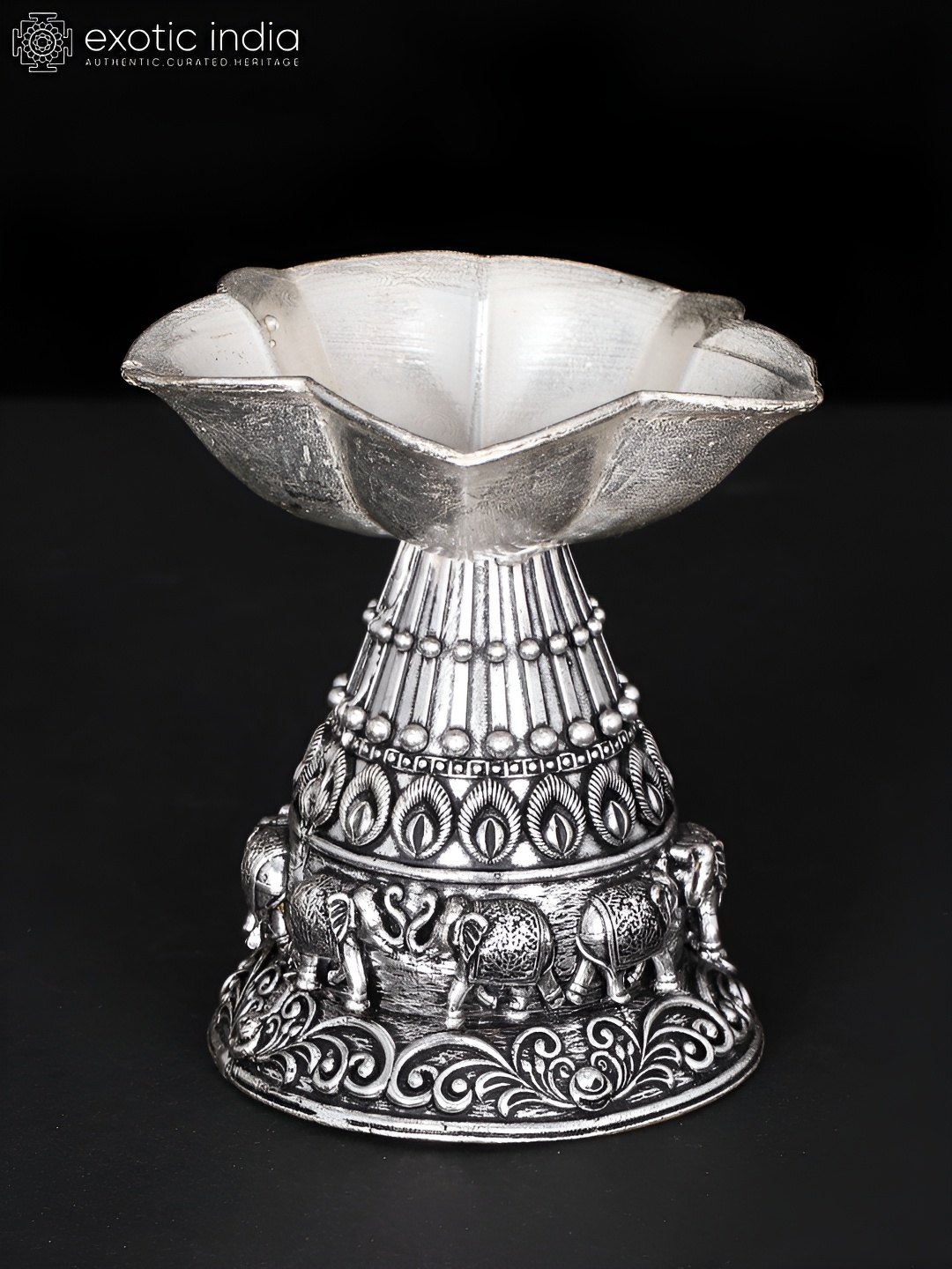 

Exotic India Silver-Toned Brass Diya Religious Figurine Showpiece