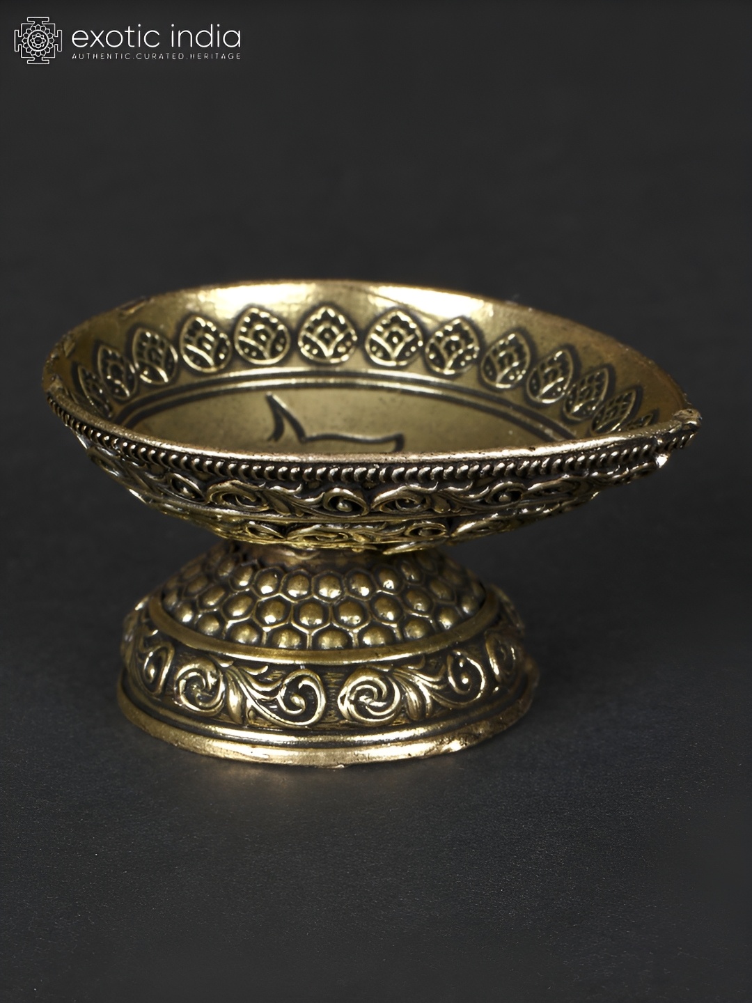 

Exotic India Gold-Toned and Black Diya in Brass Curio Showpiece