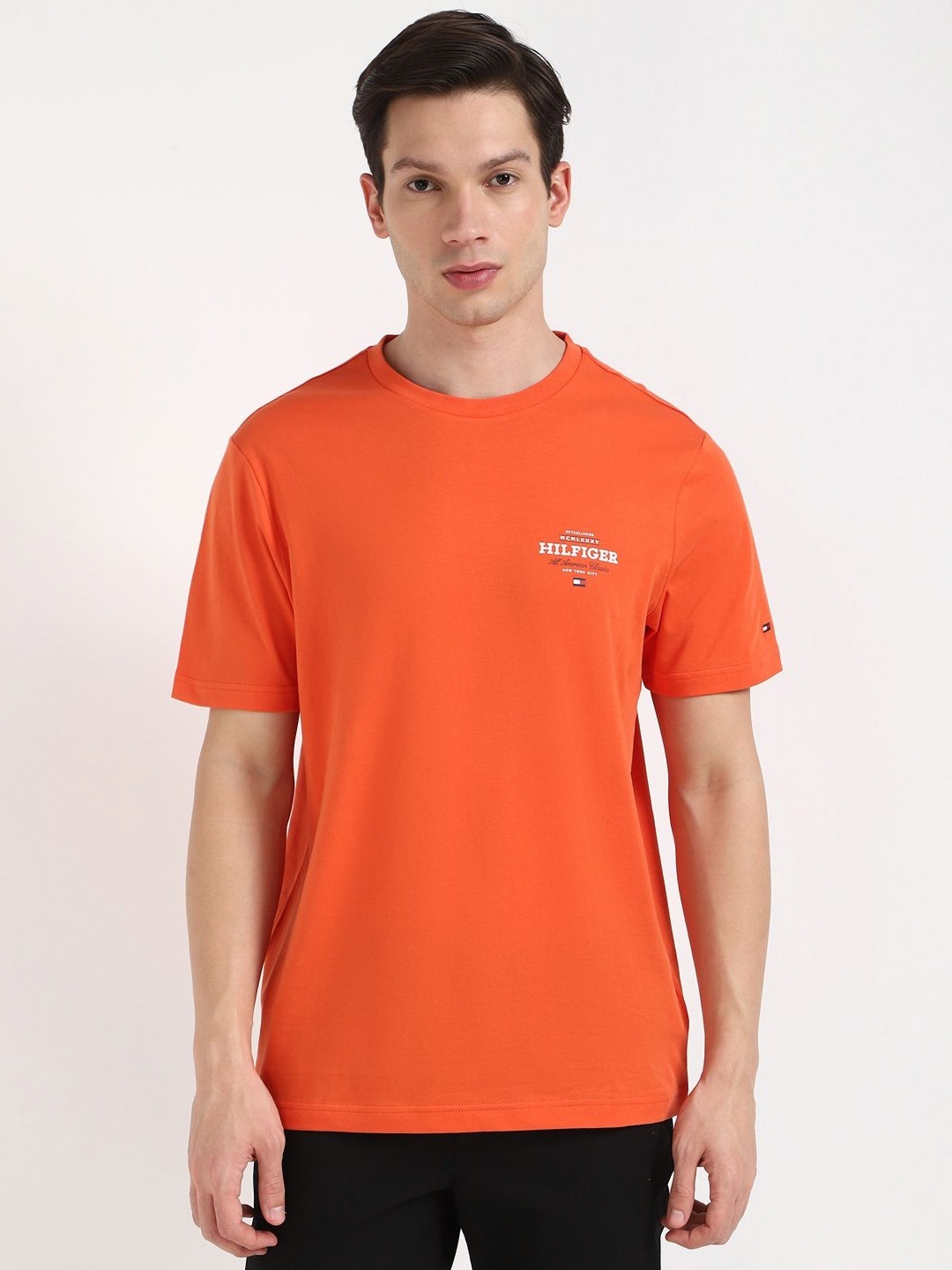 

Tommy Hilfiger Men Solid Round Neck Cotton T-shirt, Orange