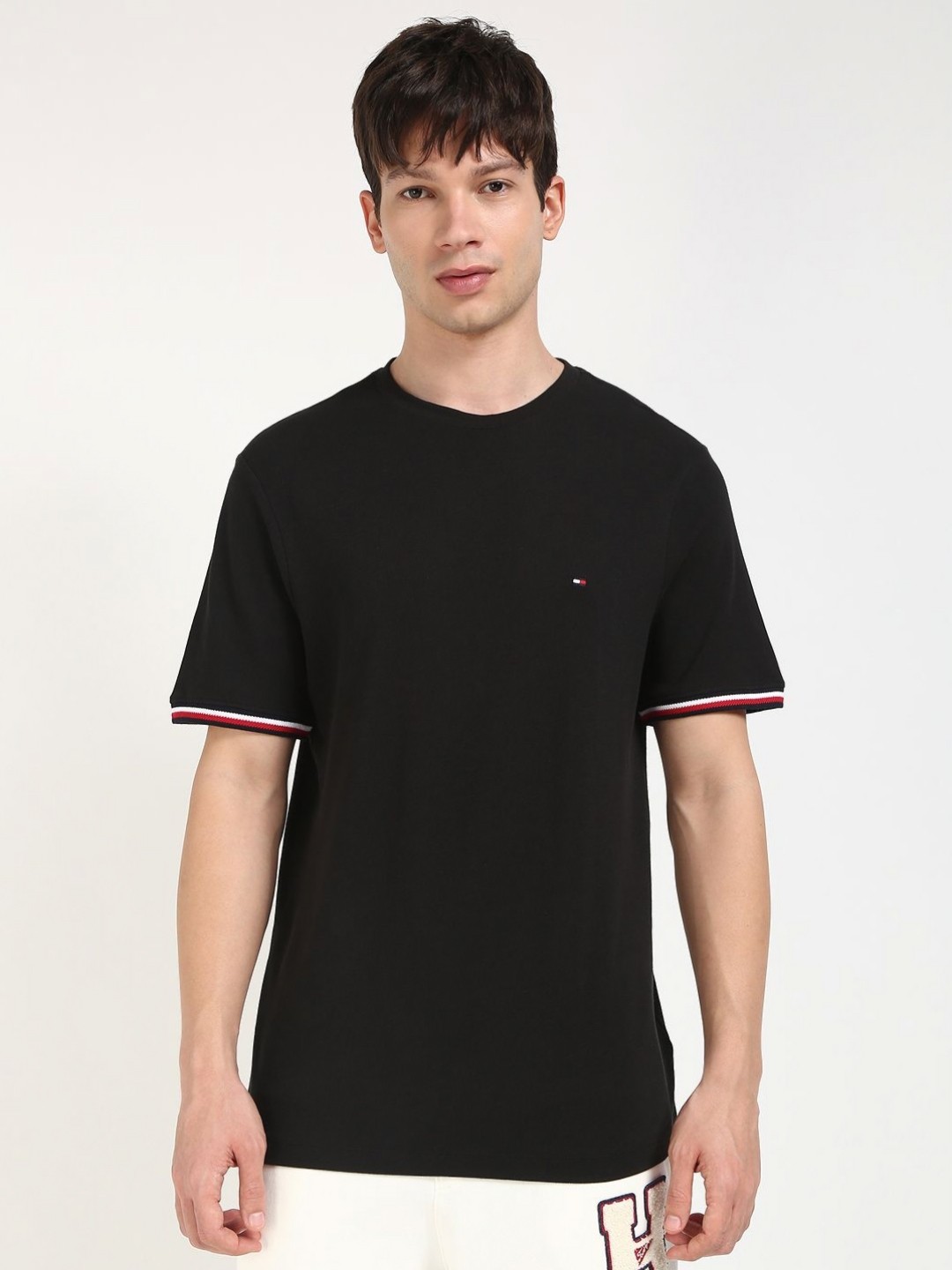 

Tommy Hilfiger Men Solid Round Neck Cotton T-shirt, Black
