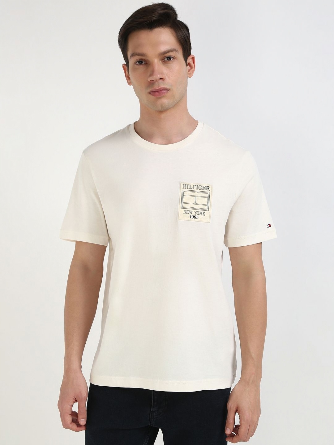 

Tommy Hilfiger Men Solid Round Neck Cotton T-shirt, Off white