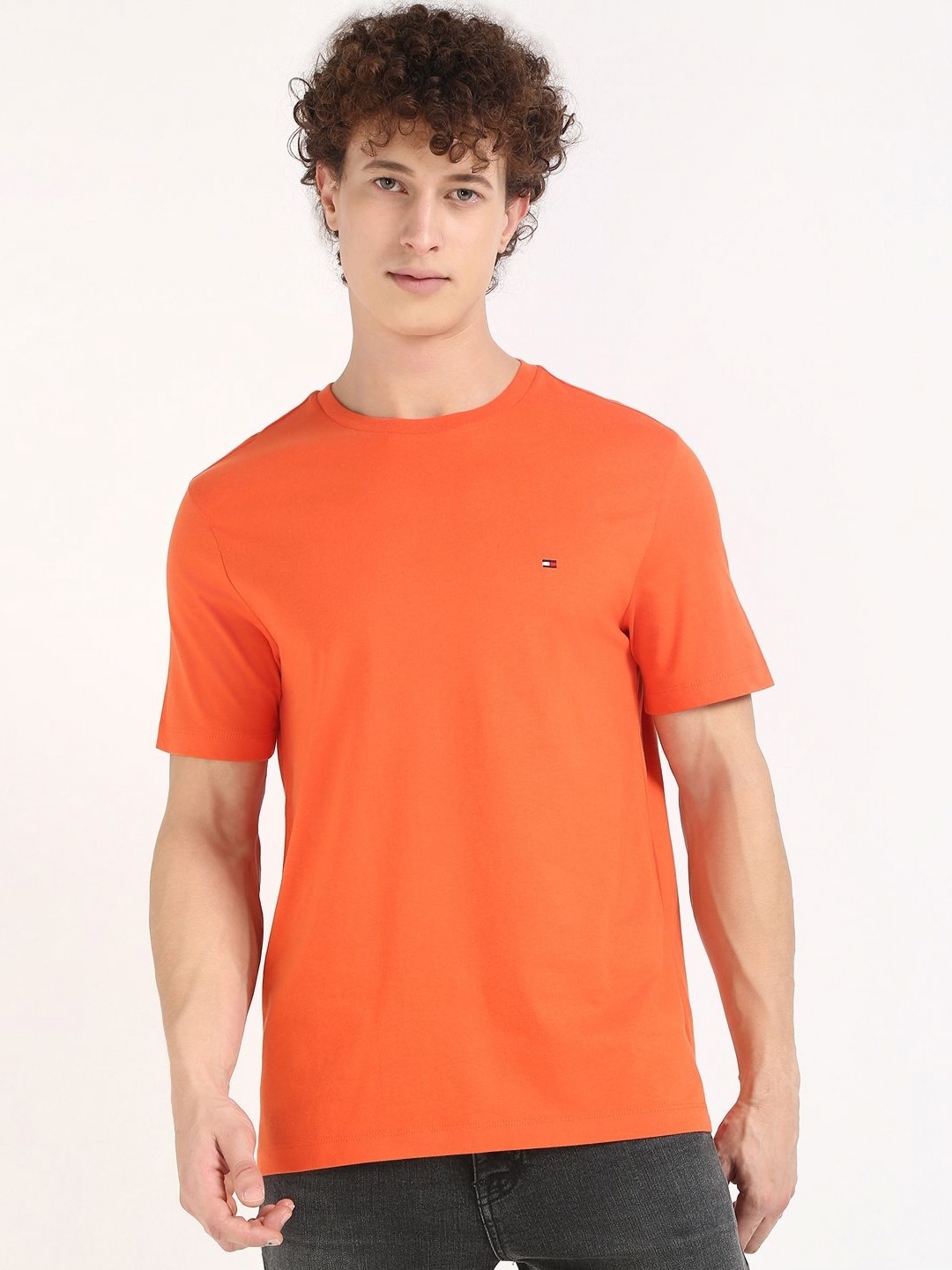 

Tommy Hilfiger Men Solid Round Neck Cotton T-shirt, Orange