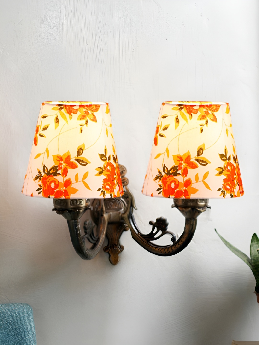

Aura Devansh White & Red Floral Printed Metal Traditional Abstract Shaped Wall Lamp