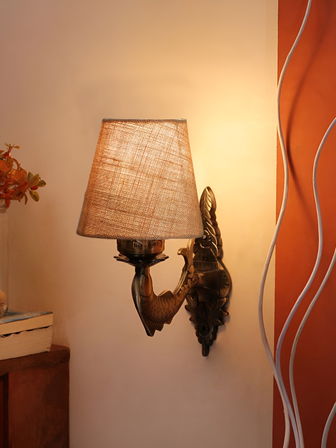 

Aura Devansh Beige & Bronze-Toned Textured Metal Traditional Abstract Shaped Wall Lamp