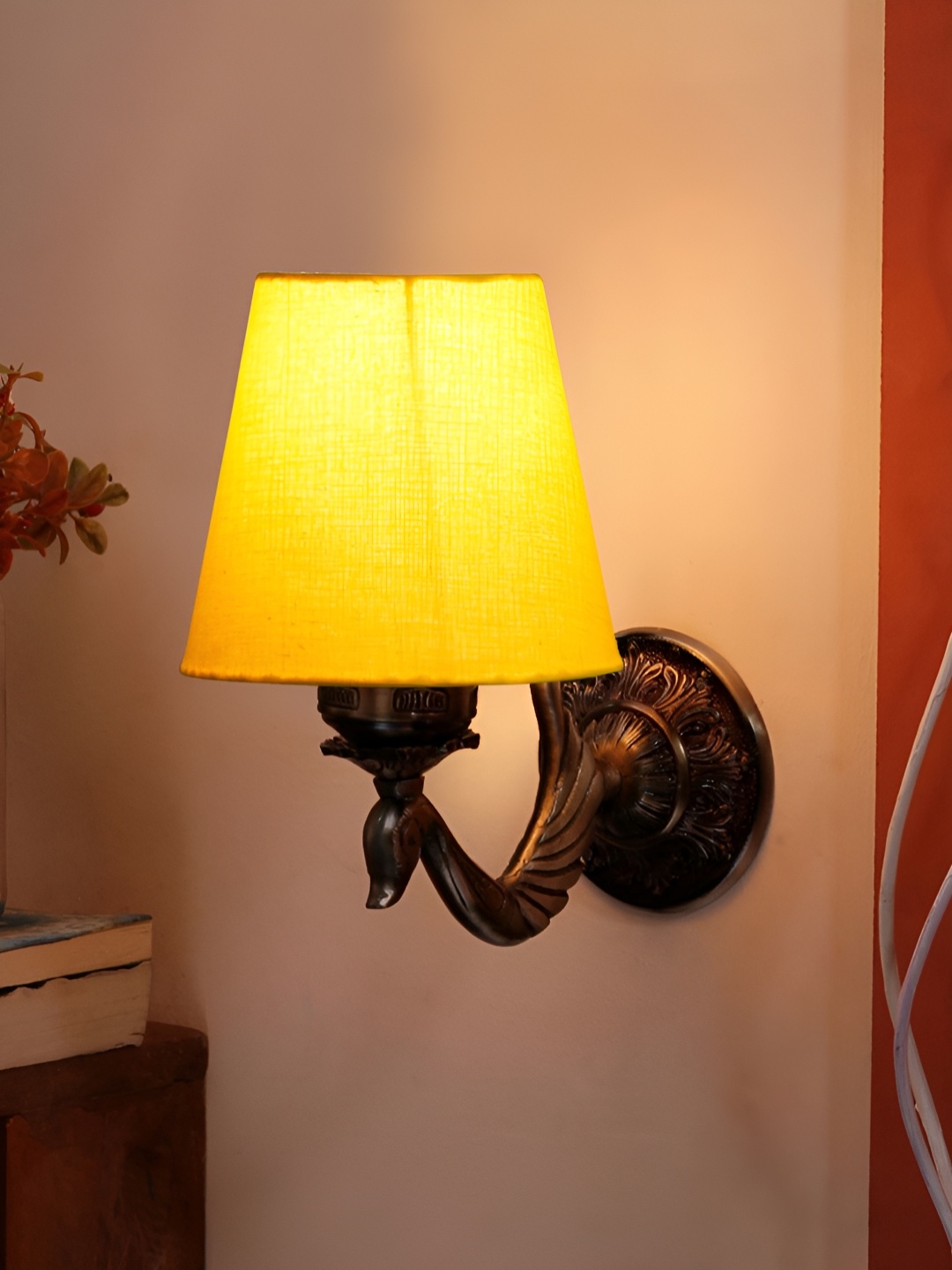 

Aura Devansh Yellow & Brown Metal Traditional Abstract Shaped Wall Lamp