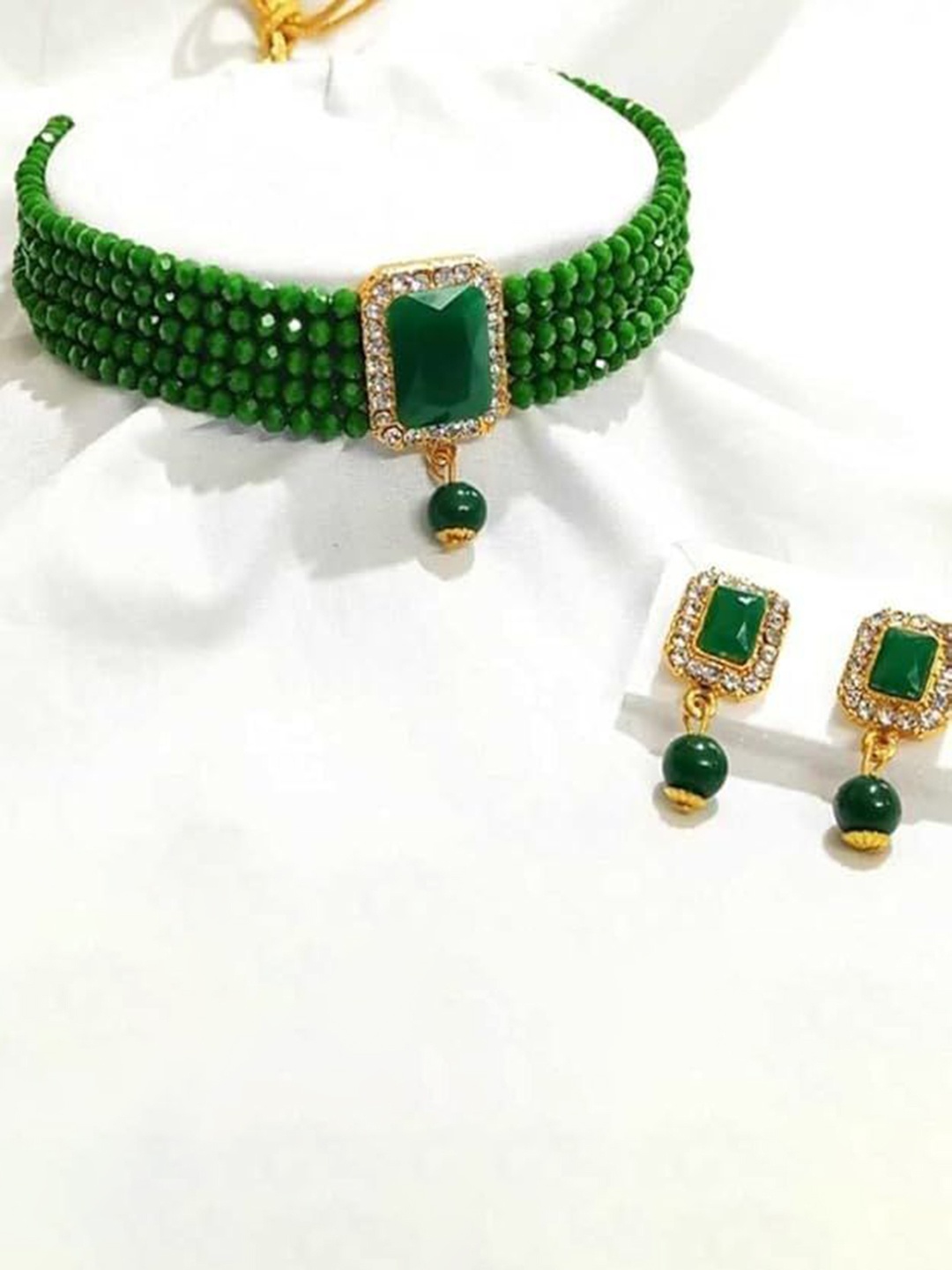 

Kezlin Gold-Plated Stone Studded & Beaded Kottage Choker Jewellery Set