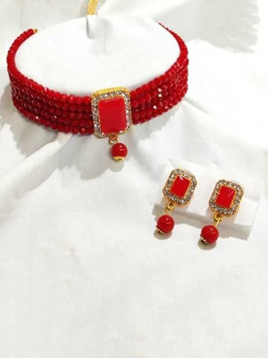 

Kezlin Gold-Plated Stone Studded & Beaded Kottage Choker Jewellery Set