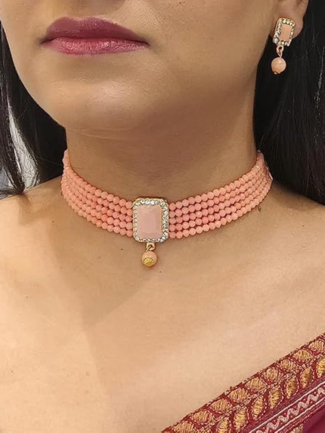 

Kezlin Gold-Plated Stone Studded & Beaded Kottage Choker Jewellery Set