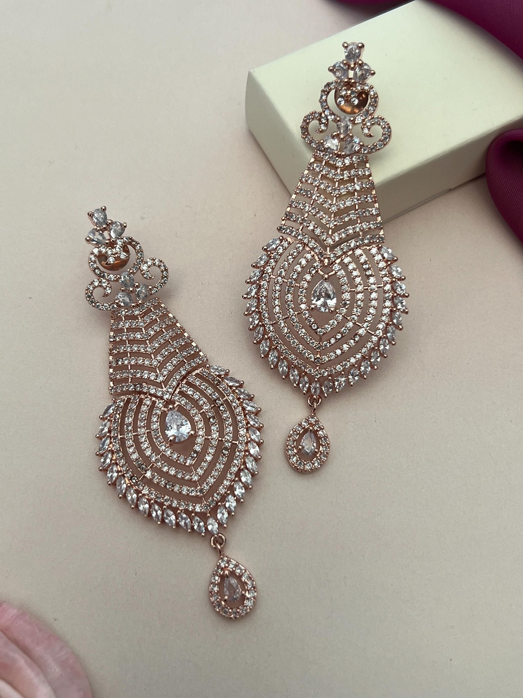 

Anouk White And Rose Gold-Plated American Diamond Studded Contemporary Drop Earrings