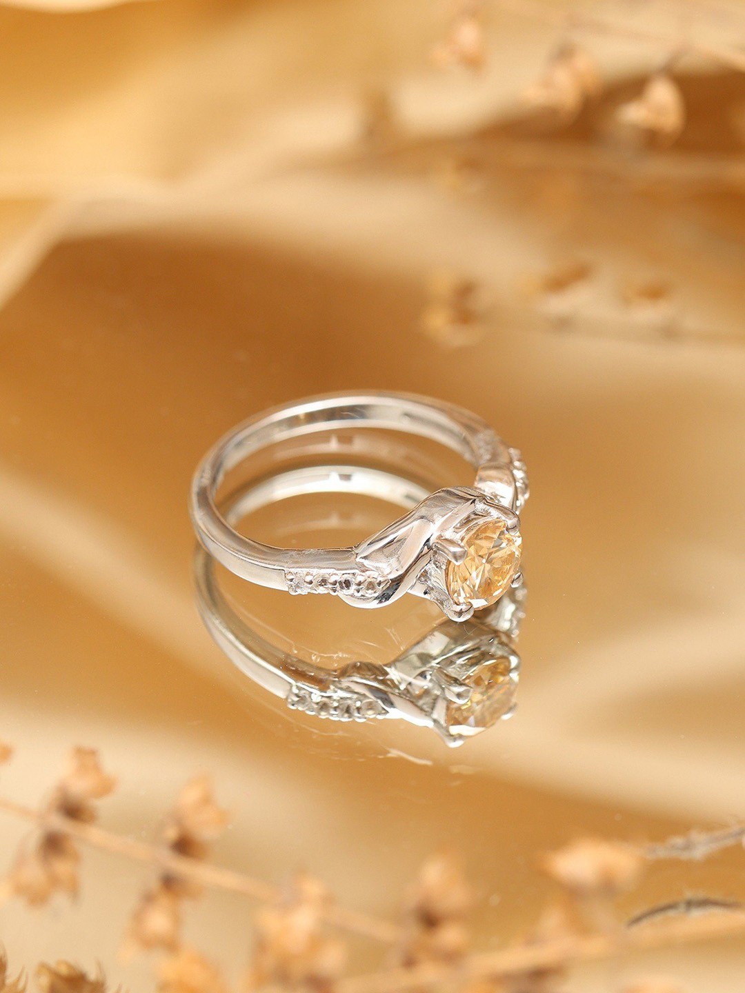 

Exotic India Sterling Silver Ring with Round Shape Faceted Yellow Moissanite