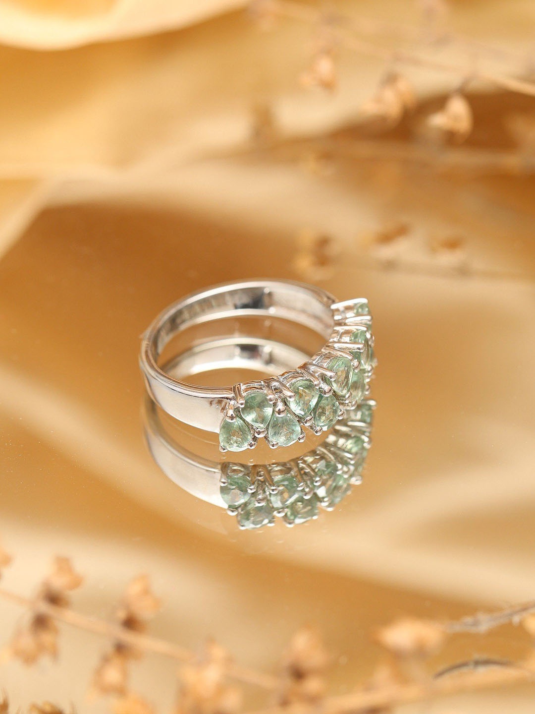 

Exotic India Sterling Silver Ring with Faceted Green Sapphire