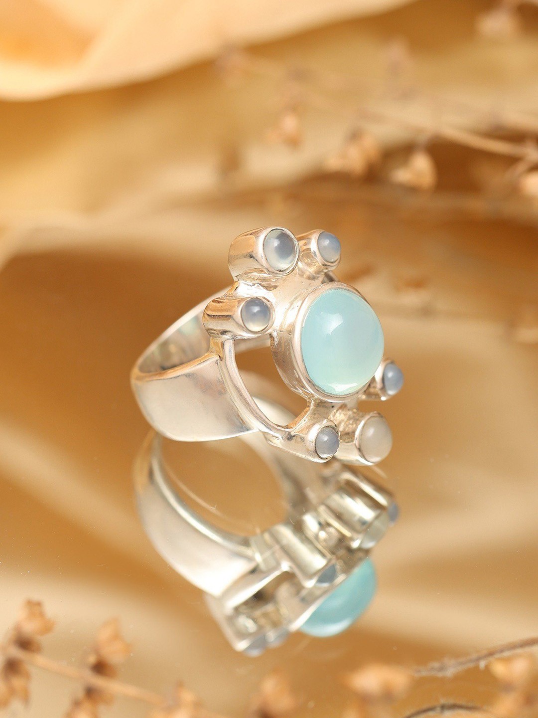 

Exotic India Sterling Silver Ring with Aqua Chalcedony Gemstone