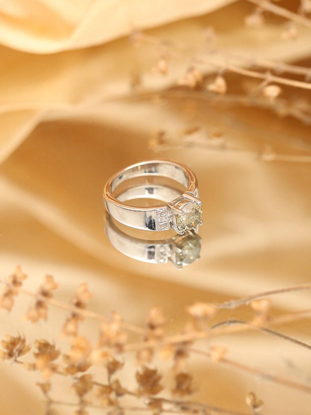 

Exotic India Sterling Silver Ring with Round Shape Light-Yellow Moissanite
