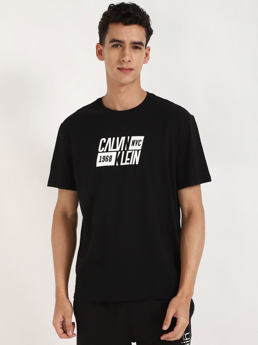 

Calvin Klein Jeans Men Typography Printed Round Neck Cotton T-shirt, Black