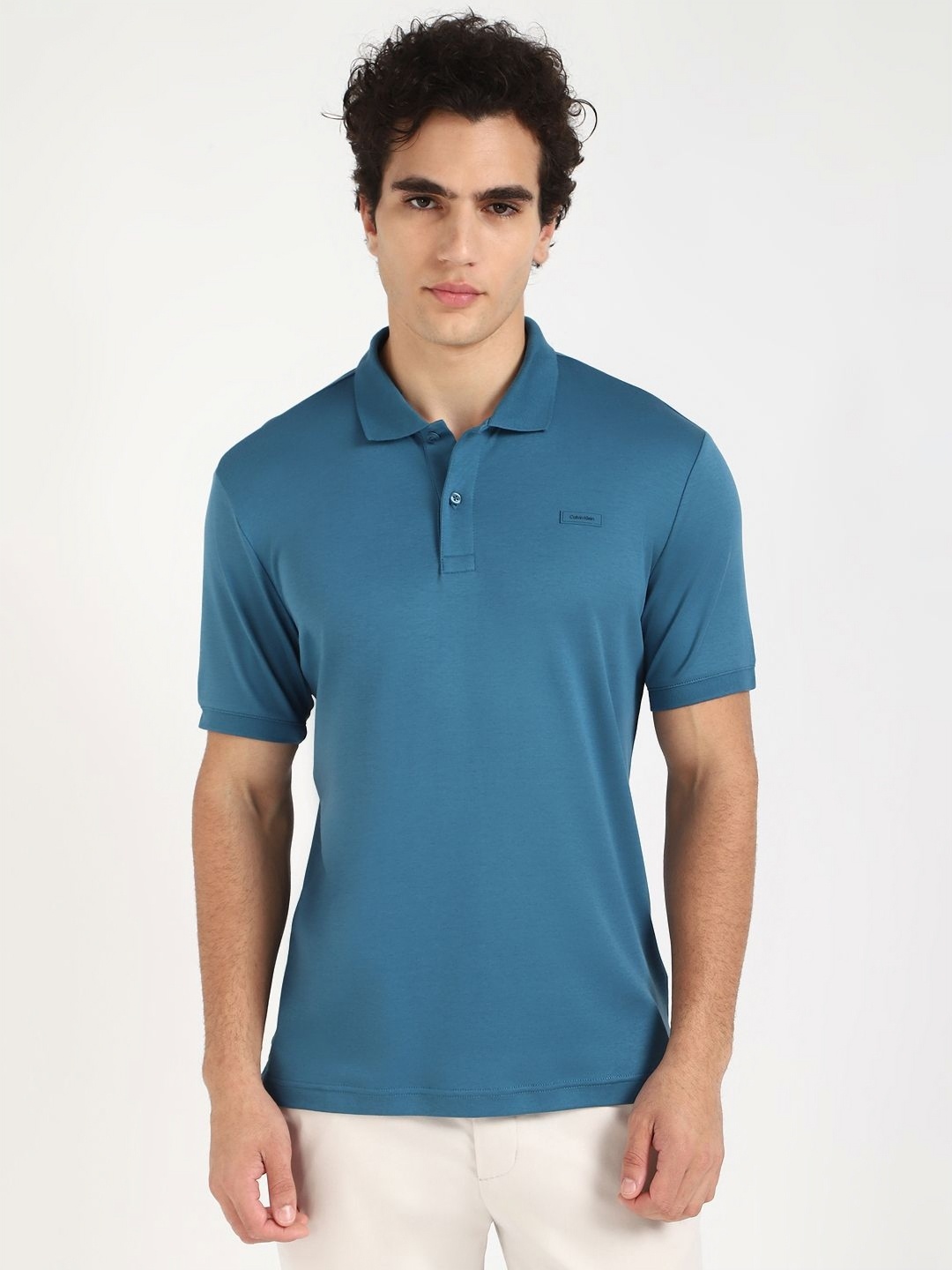 

Calvin Klein Jeans Men Solid Round Neck Cotton Slim Fit T-shirt, Teal