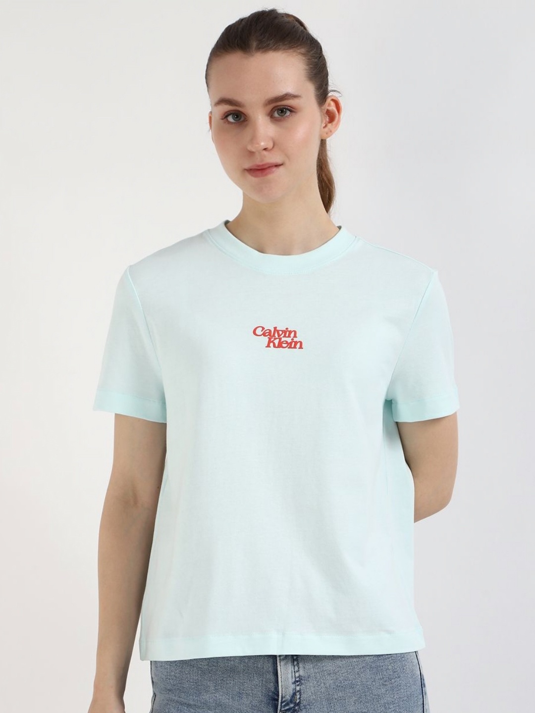 

Calvin Klein Jeans Women Solid Round Neck Cotton T-shirt, White