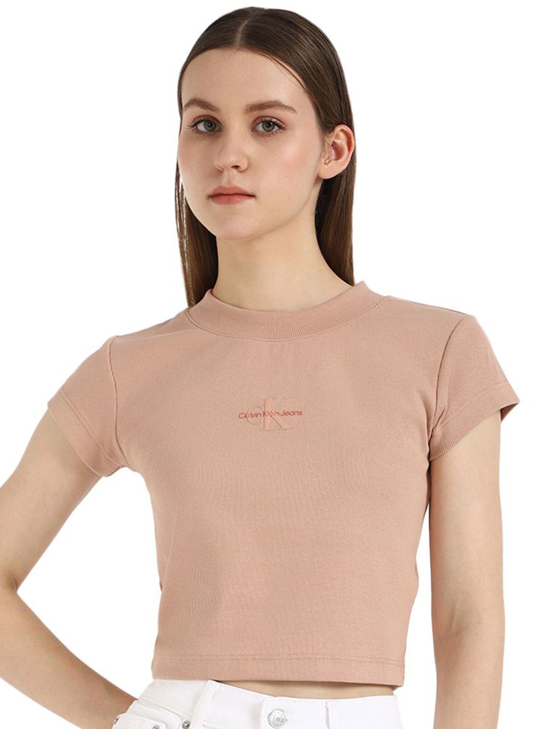 

Calvin Klein Jeans Women Solid Round Neck Cotton T-shirt, Peach