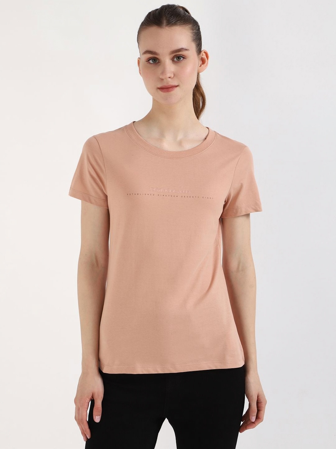 

Calvin Klein Jeans Women Typography Printed Round Neck Cotton T-shirt, Peach