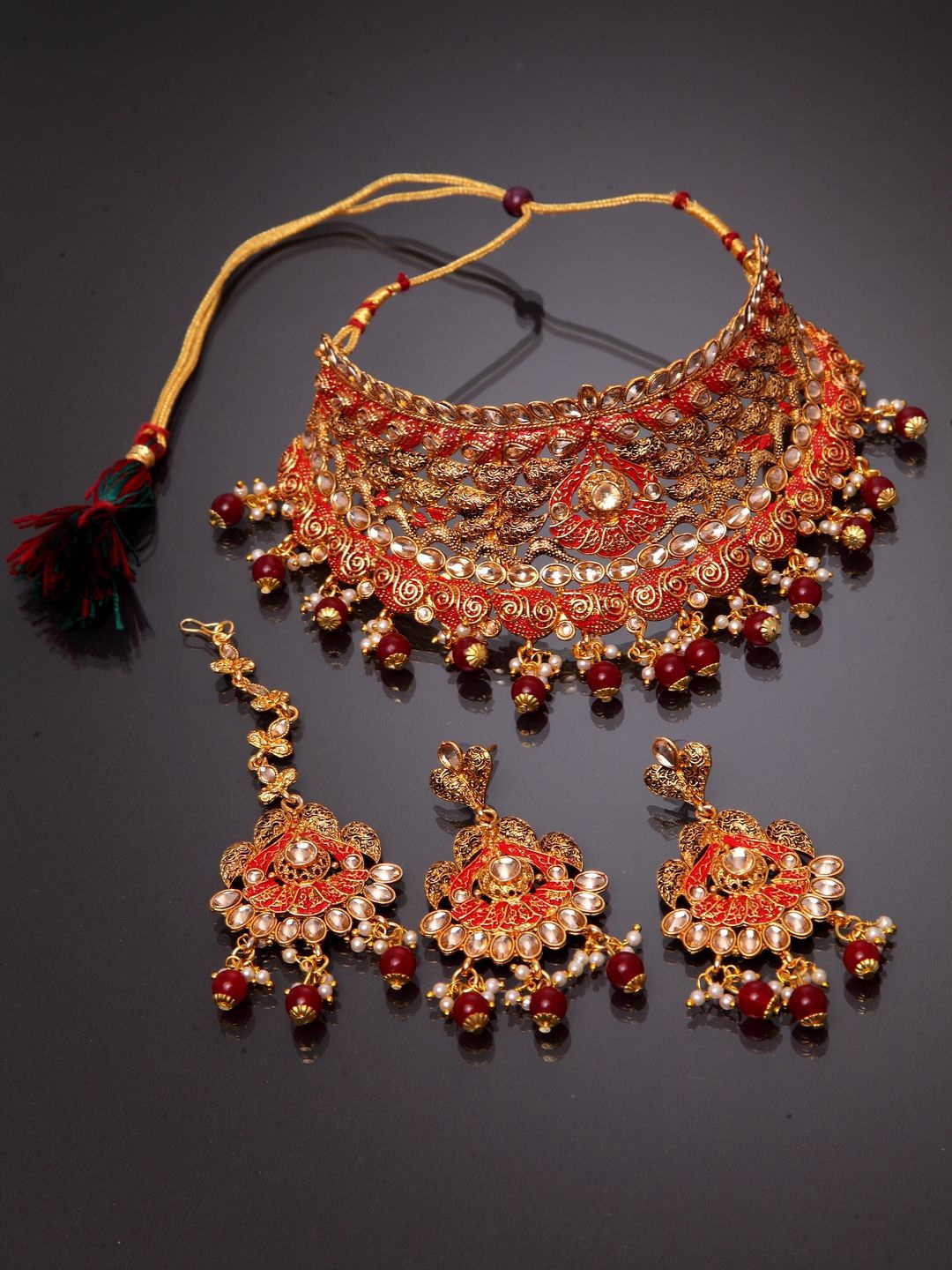 

ANIKAS CREATION Gold-Plated Stone Studded & Beaded Necklace and Earrings With Maang Tika