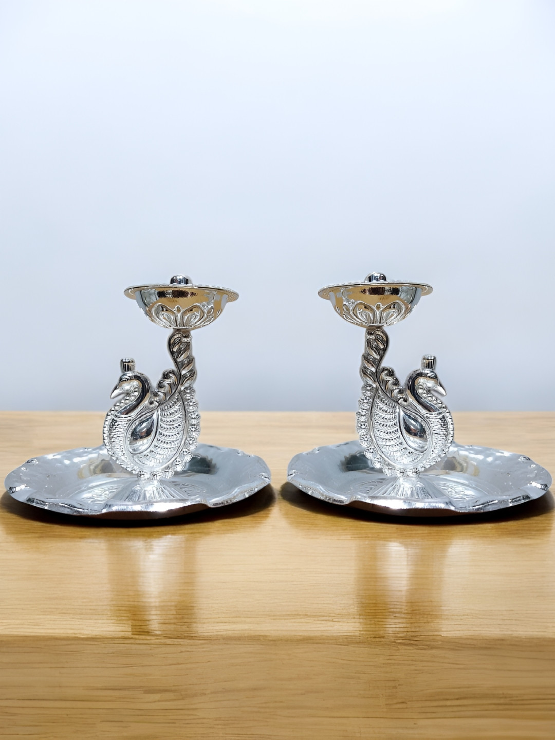 

Sigaram Silver Toned 2 Pcs Textured Fancy Peacock Diya For Pooja Decore