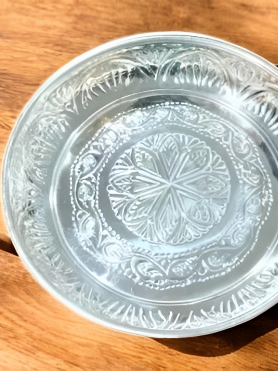 

Sigaram German Silver Textured Floral Designed Plate With Stand Pooja Essentials