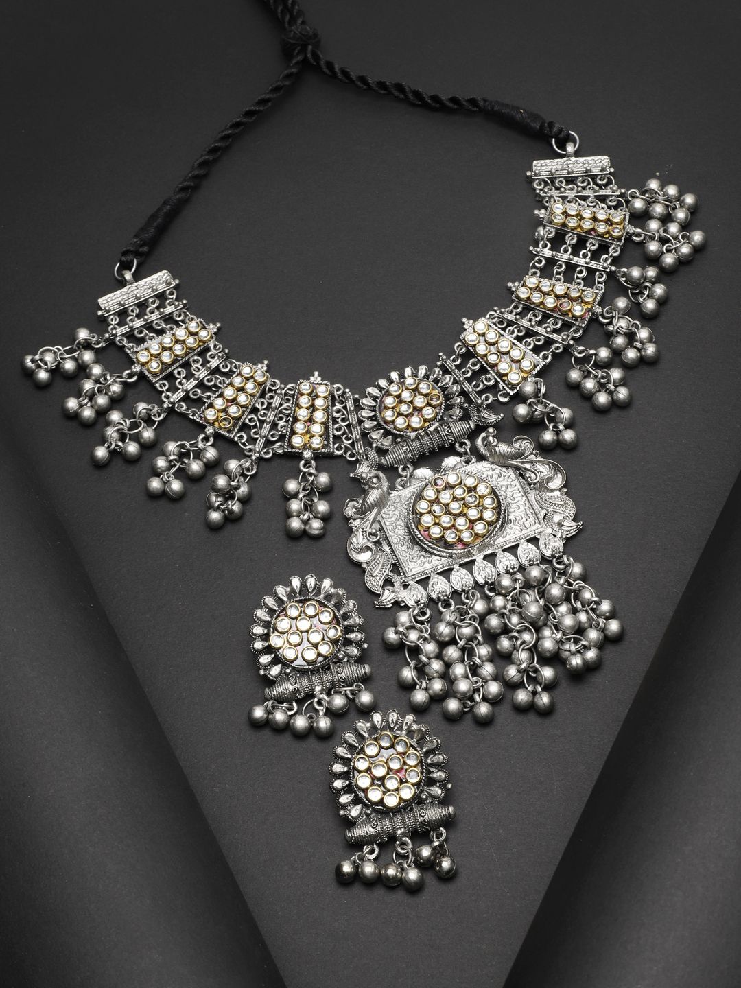 

Moedbuille Silver Plated Kundan Studded Tribal Tasselled Design Oxidised Jewellery Set