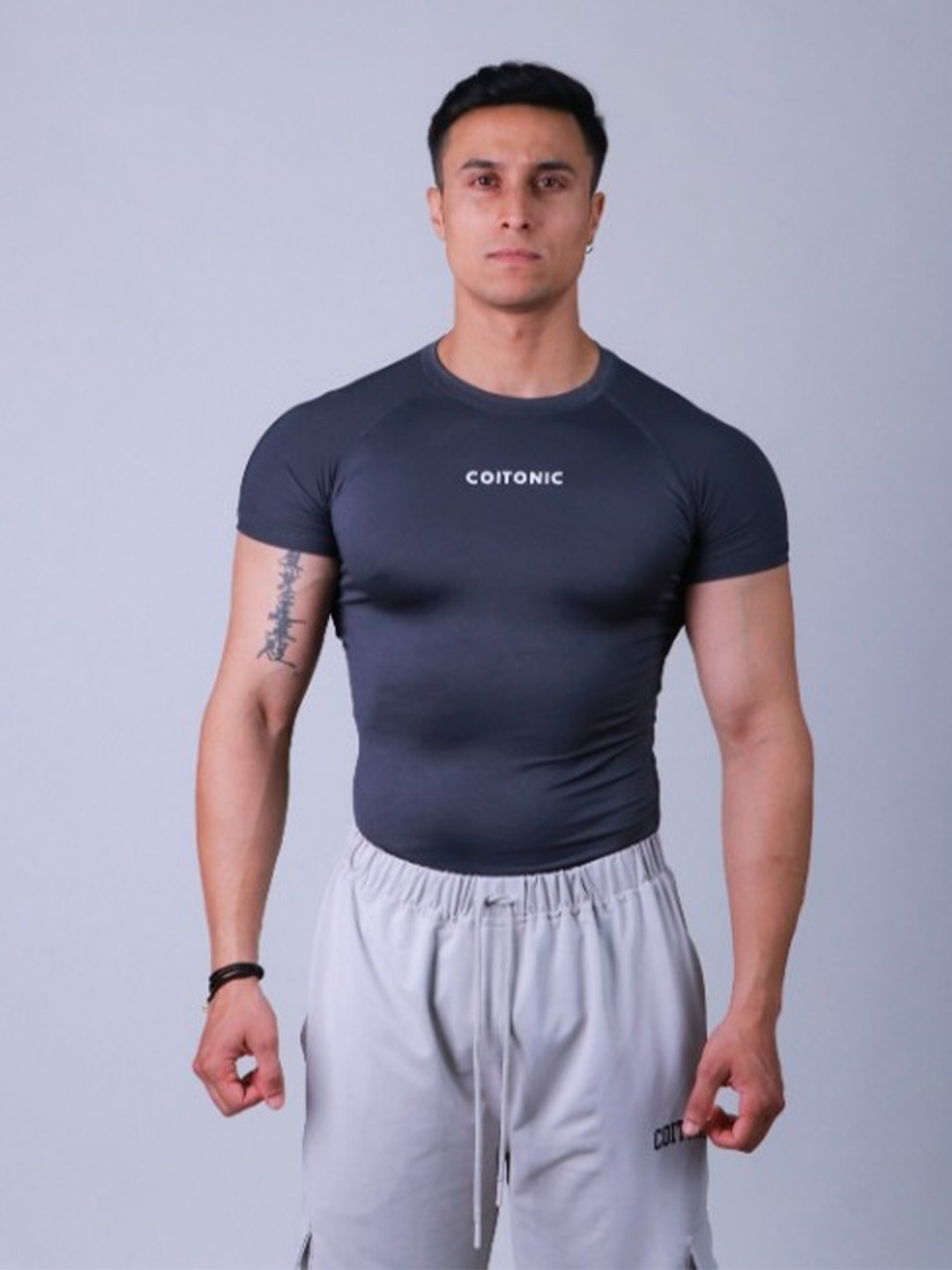 

Coitonic Men Typography Printed Round Neck Compression T-shirt, Grey