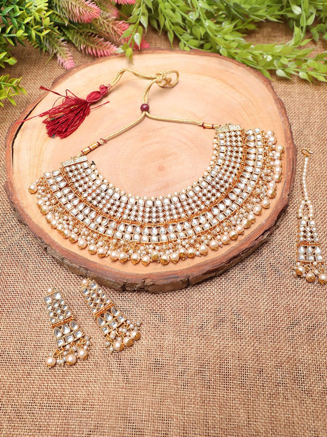 

Ethnicking Gold Plated Kundan Stone Studded & Beaded Necklace and Earrings With Maang Tika