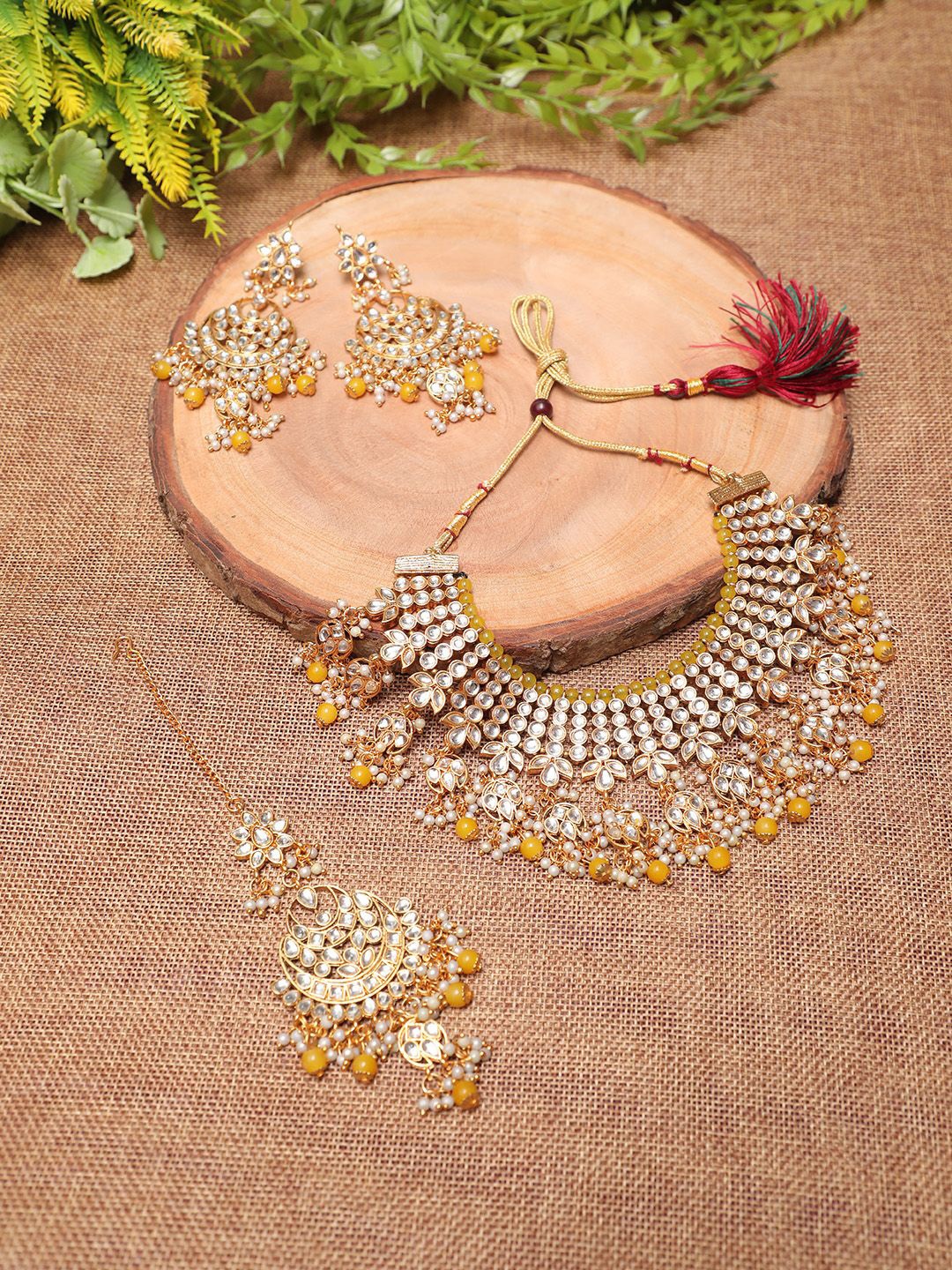 

Ethnicking Gold Plated Kundan Stone Studded & Beaded Necklace and Earrings With Maang Tika
