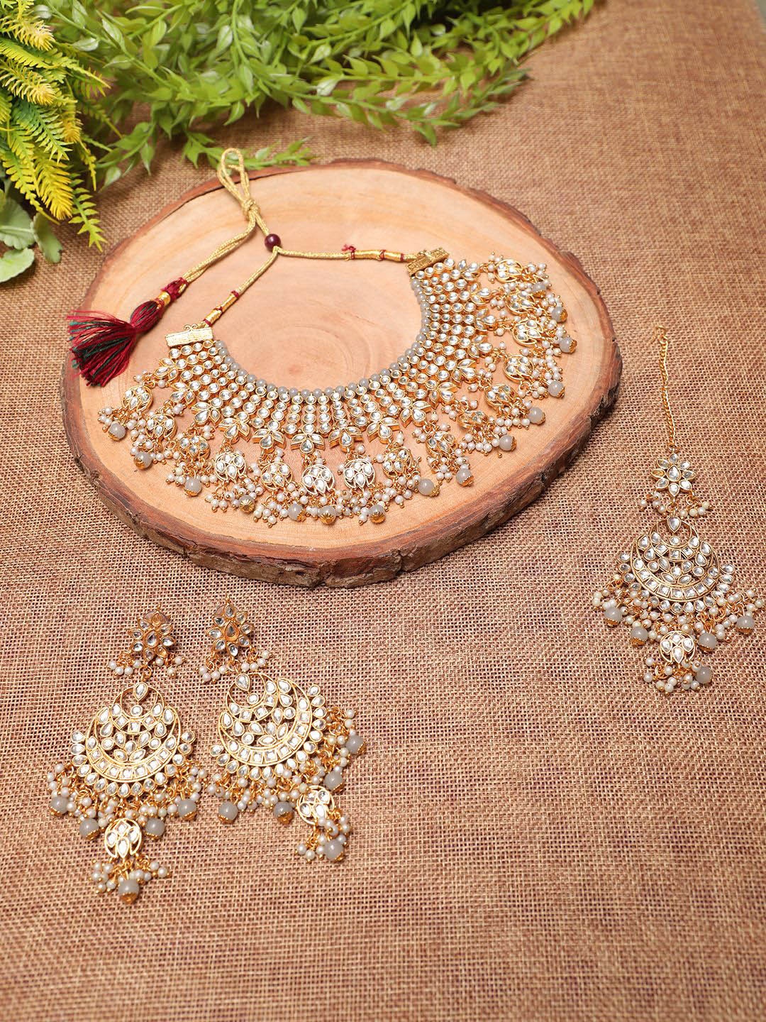 

Ethnicking Gold Plated Kundan Stone Studded & Beaded Necklace and Earrings With Maang Tika