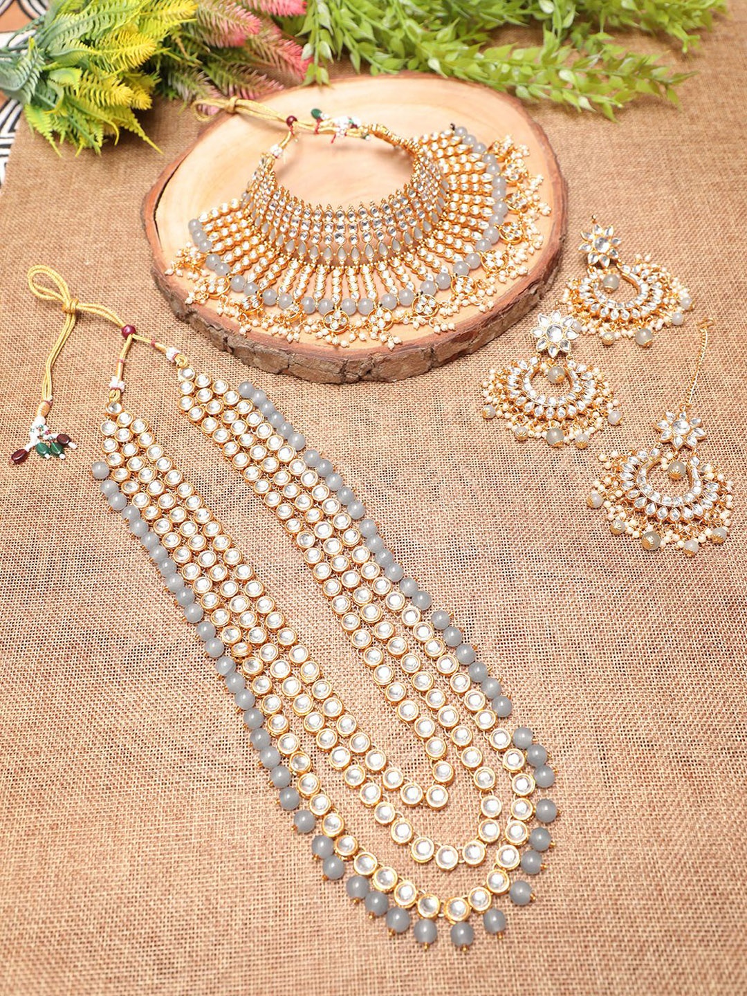 

Ethnicking Gold Plated Kundan Stone Studded & Beaded Necklace and Earrings With Maang Tika