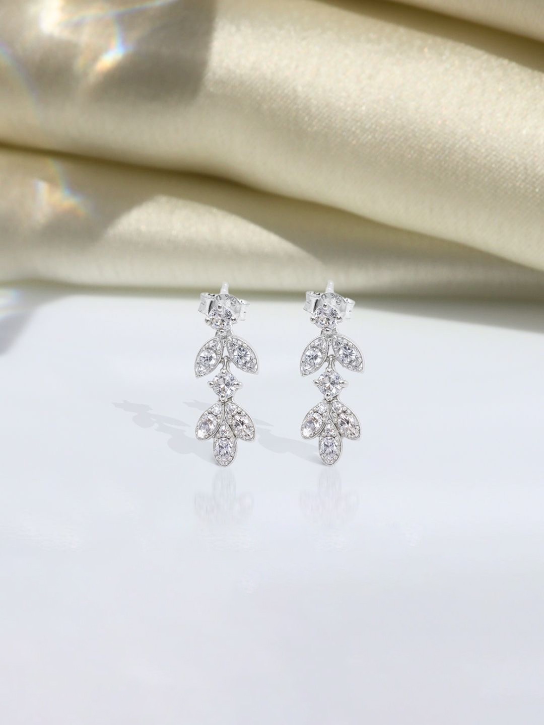 

HighSpark Sterling Silver Zircon Stone Studded Leaf Shaped Studs