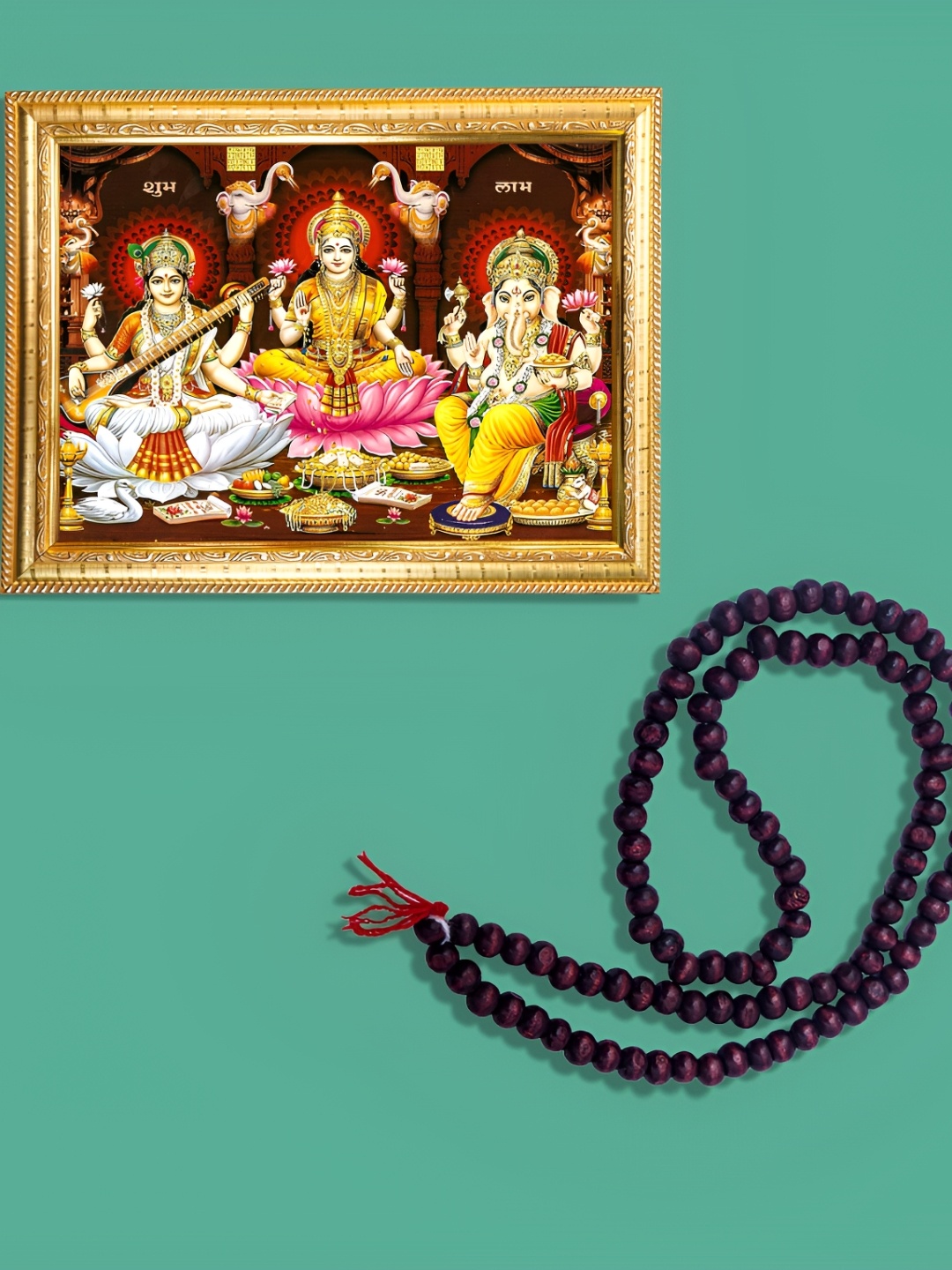 

Hawai Gold Toned Ganesh Lakshmi Saraswati Wooden Wall Photo Frame With Chandan Mala