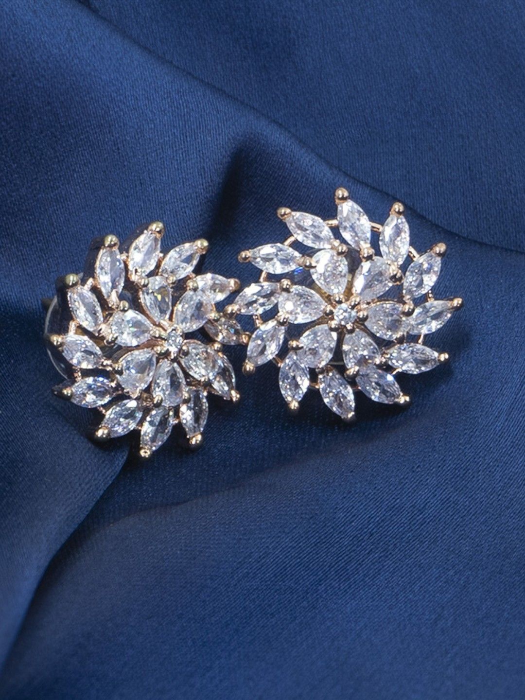 

SHARLEEZ Gold-Plated American Diamond Studded Floral Shaped Studs Earrings, Silver