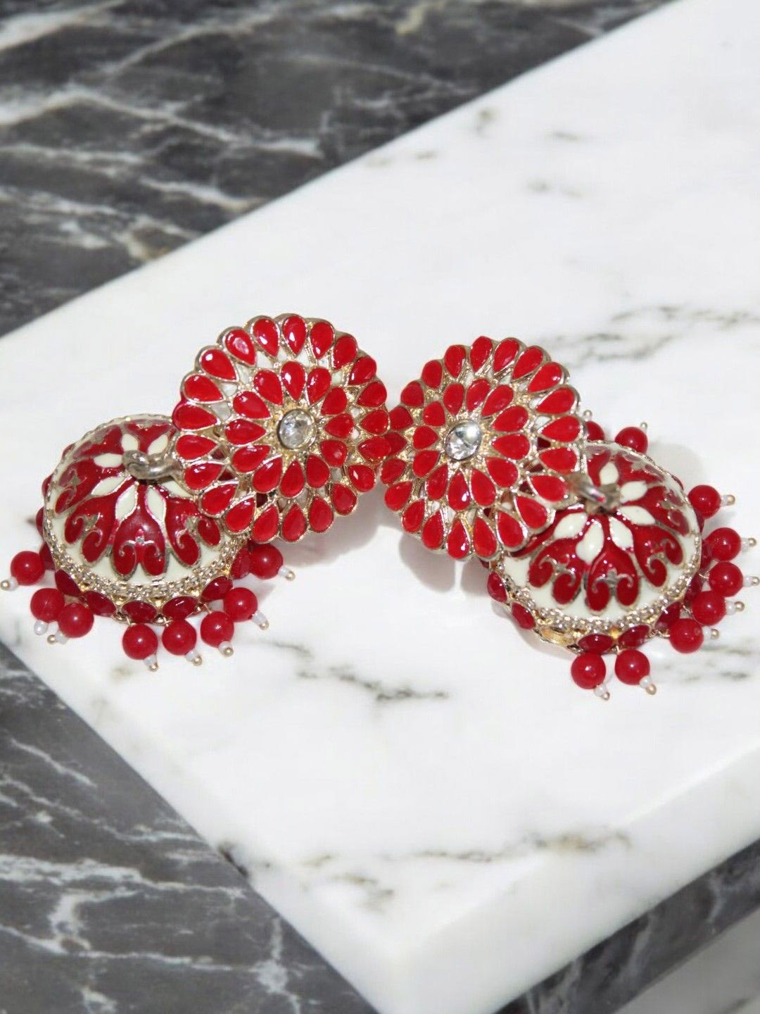 

Jolly Faces Silver-Plated Artificial Stones Studded Dome Shaped Meenakari Jhumkas