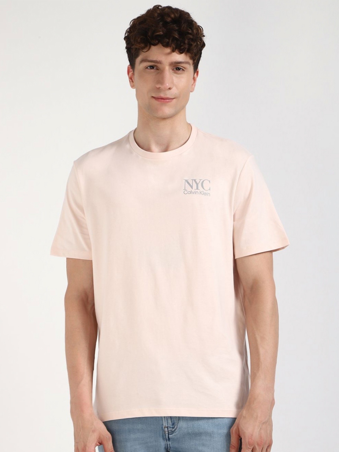 

Calvin Klein Jeans Men Typography Printed Round Neck Cotton T-shirt, Peach