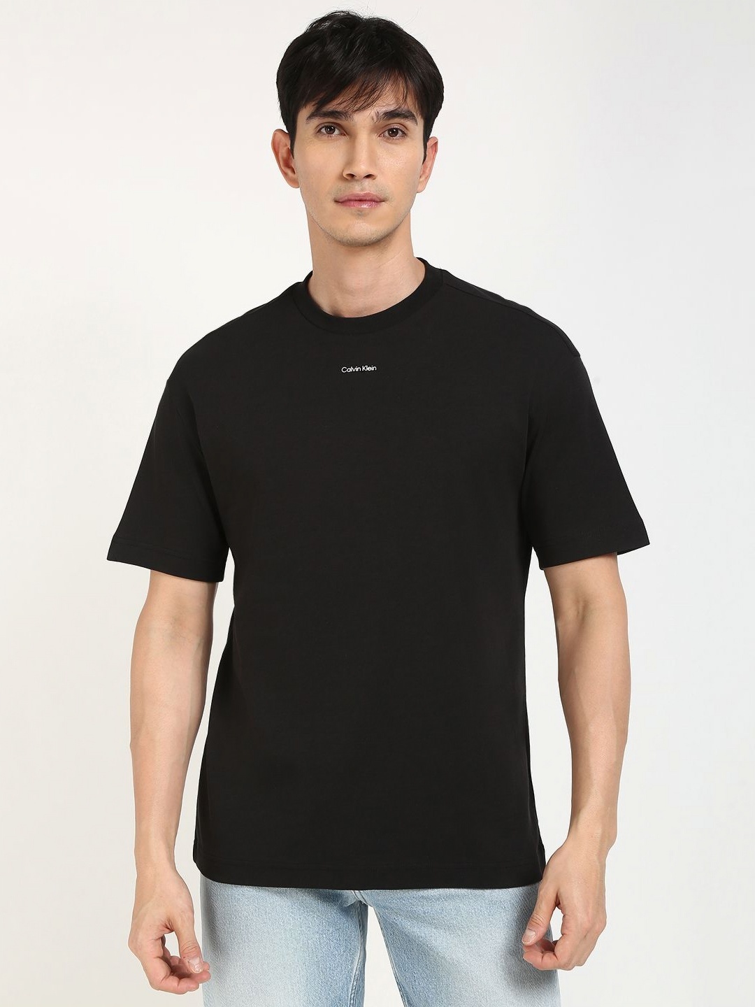 

Calvin Klein Jeans Men Solid Round Neck Cotton T-shirt, Black