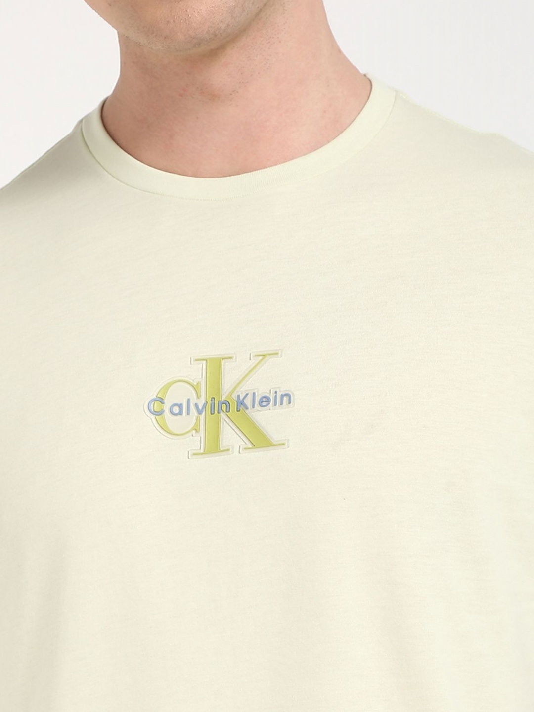 

Calvin Klein Jeans Men Typography Printed Round Neck Cotton T-shirt, Green