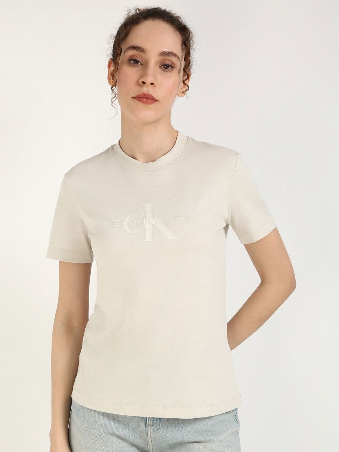 

Calvin Klein Jeans Women Typography Printed Round Neck Cotton T-shirt, Grey