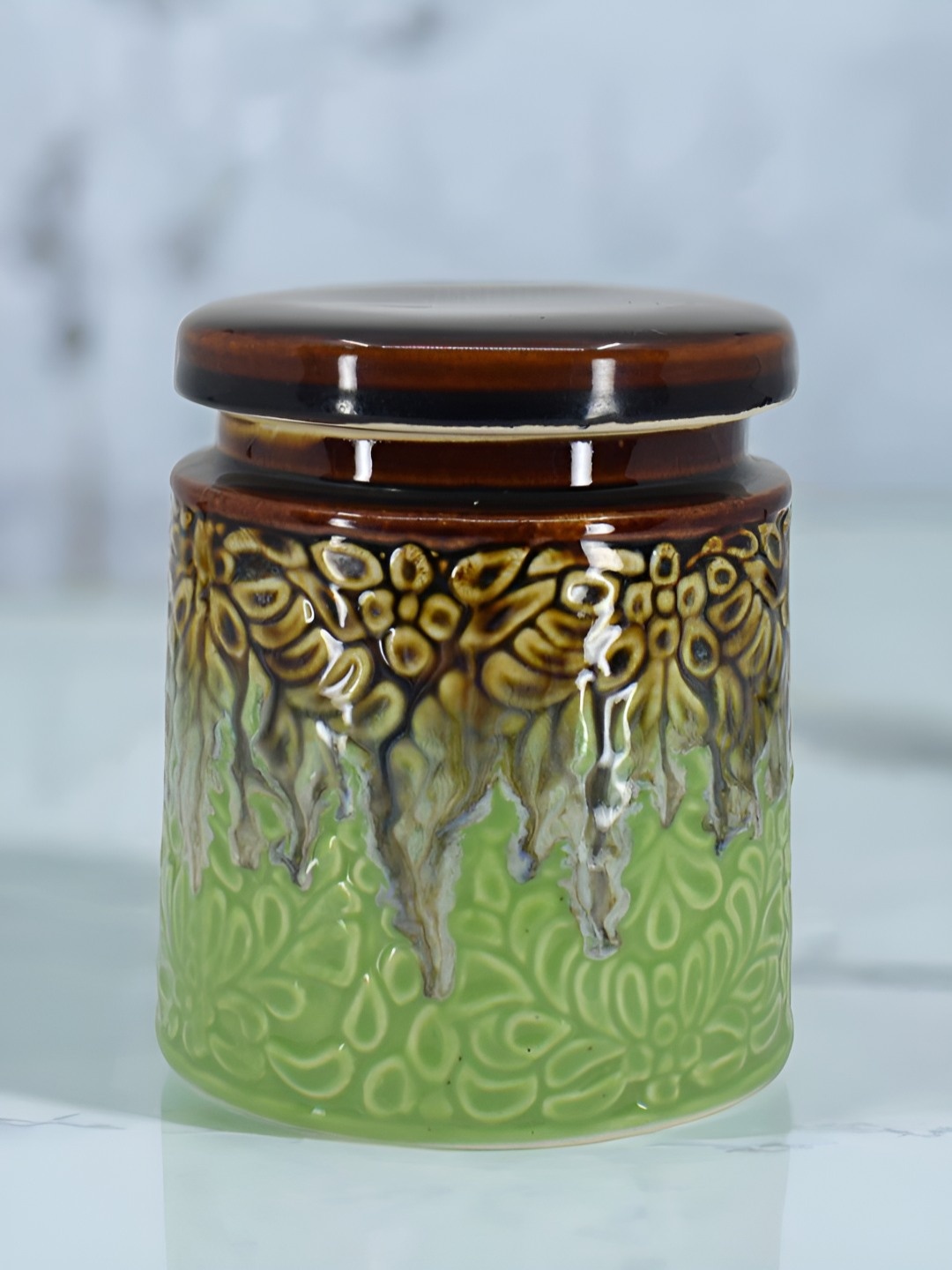 

The Decor Lane Green & Gold Toned Printed Ceramic Microwave Safe Canister Container 1Ltr